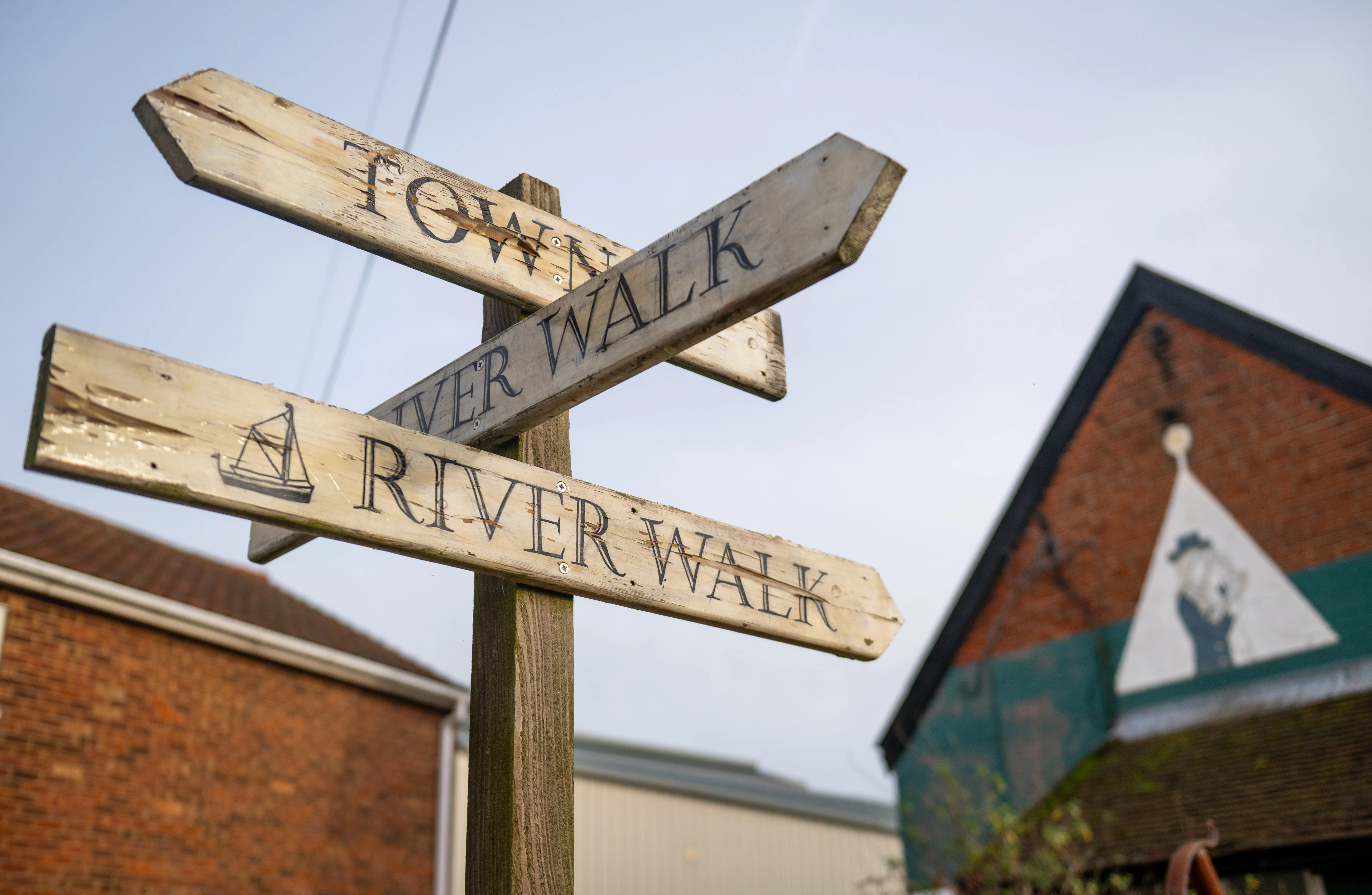 Wooden town and River walk signs
