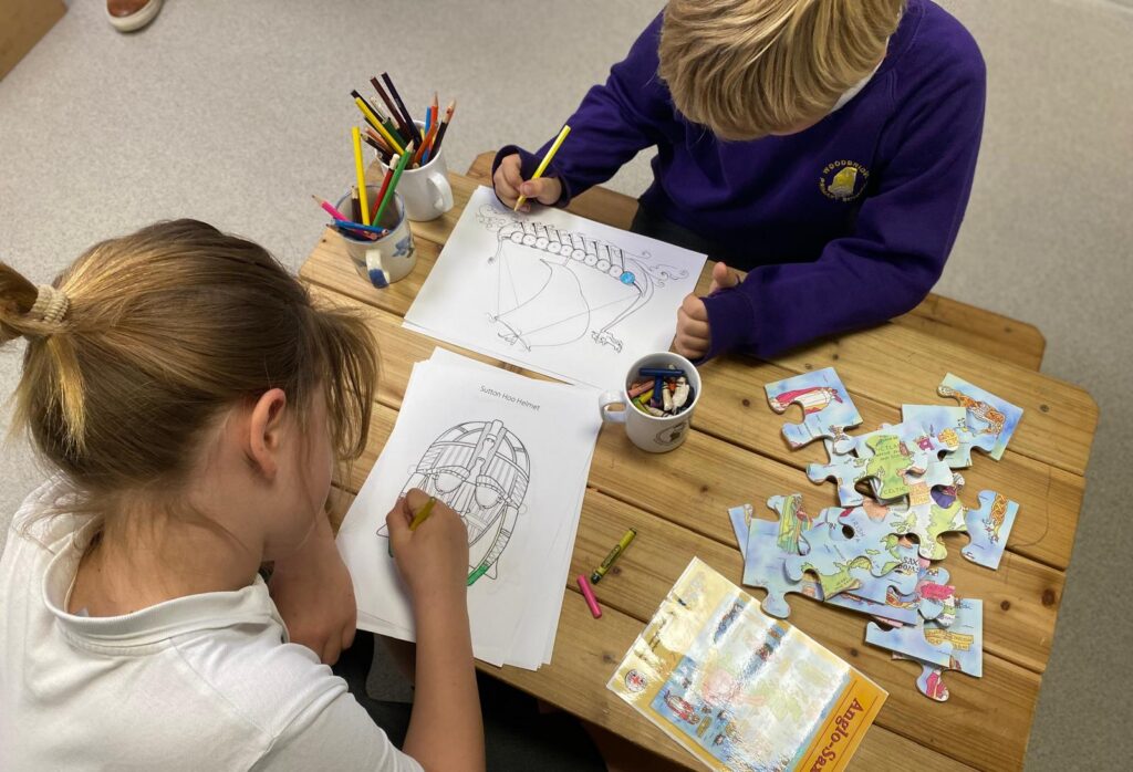 Children colouring at a table
