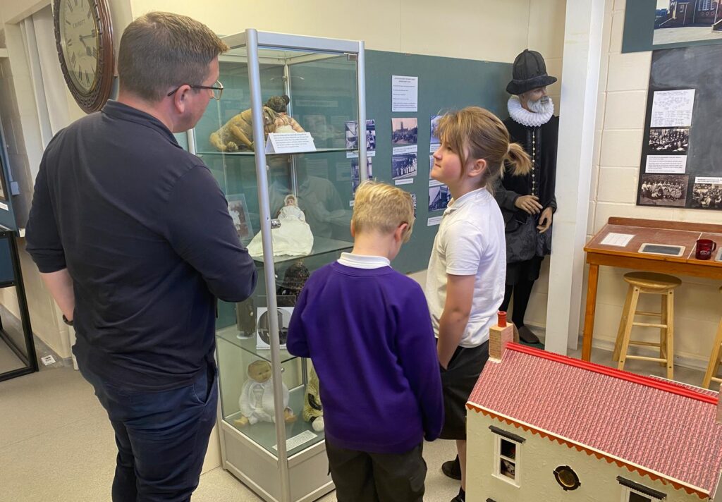 Children looking at museum exhibits
